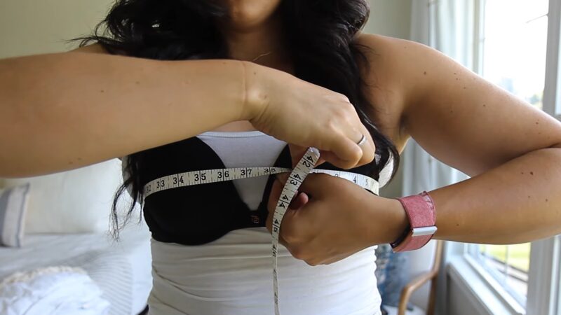 Woman measuring breast size